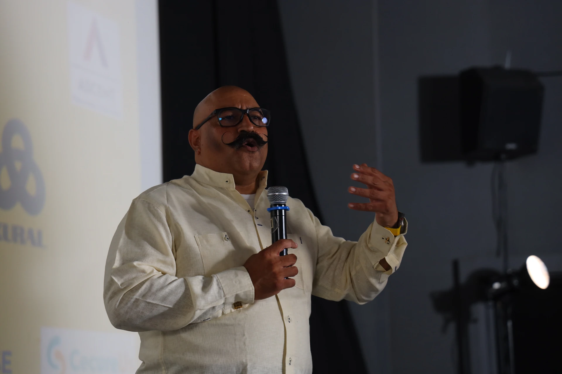 Pravin Shekar, speaking with microphone